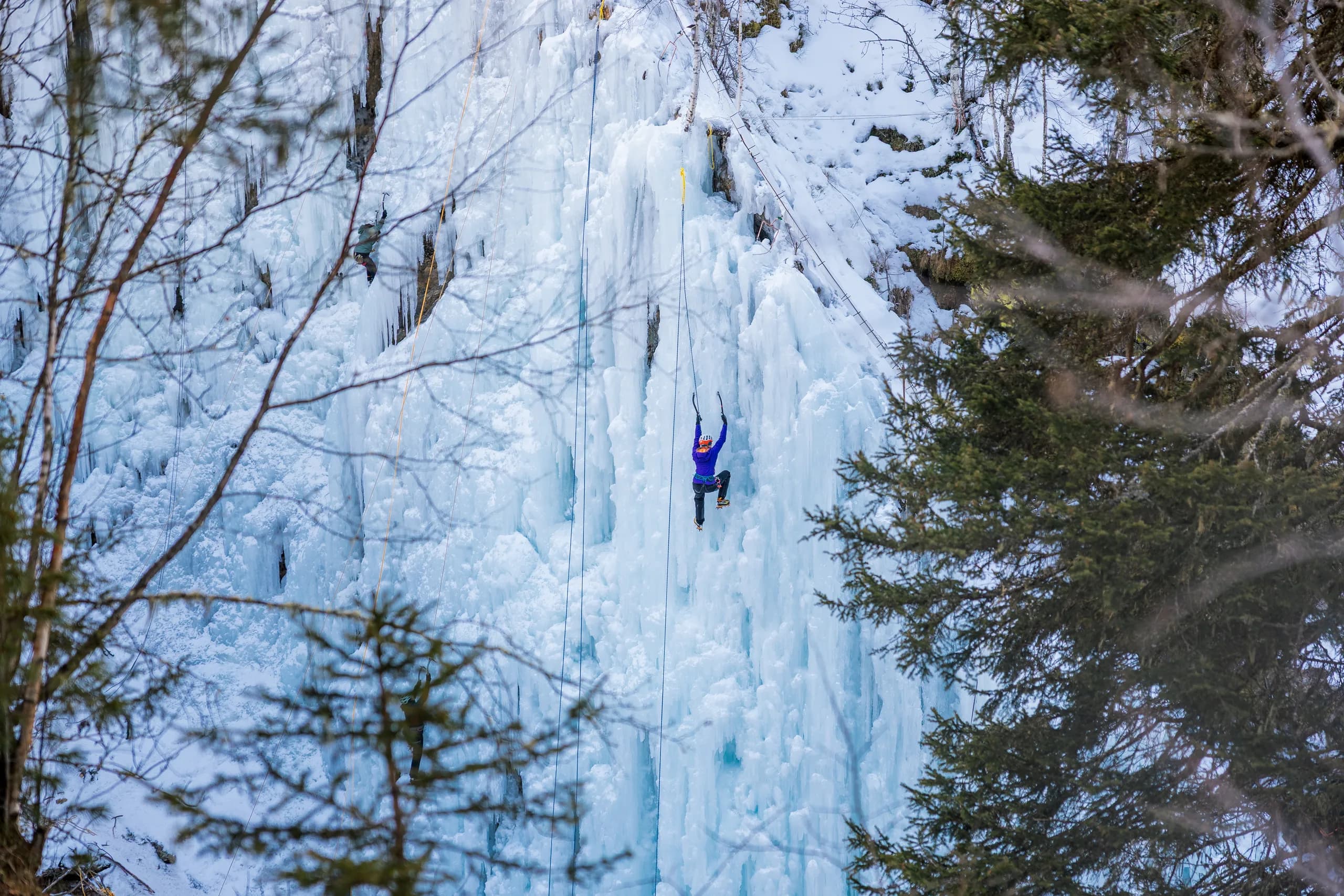 Ice climber at the frozen waterfall in the Taschach Gorge